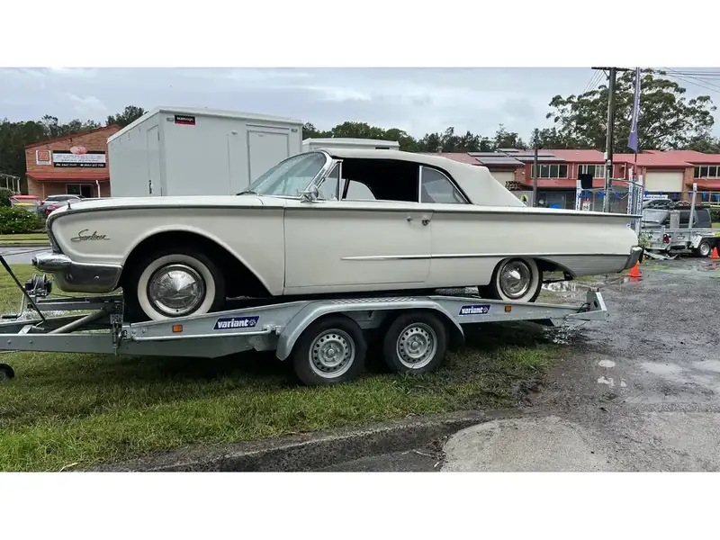 Car and plant combination trailer with slide-out ramps and a winch