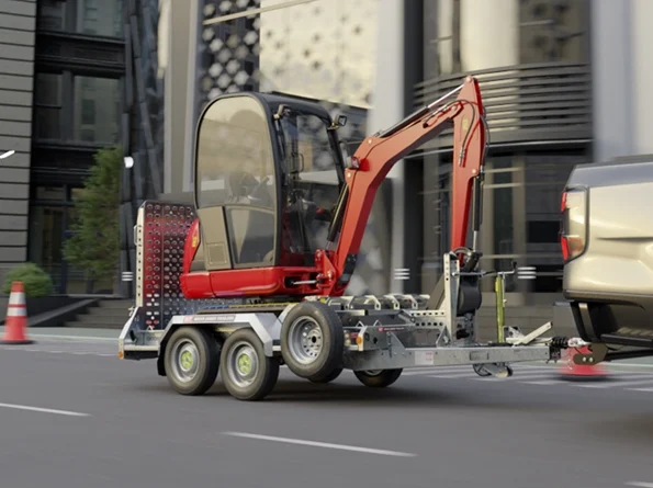 Excavator loaded on a plant trailer for road transport