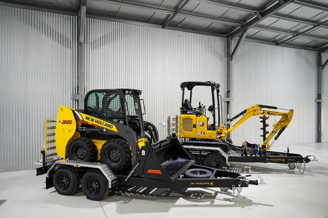 Skid steer loader and mini excavator loaded together on a tandem plant trailer