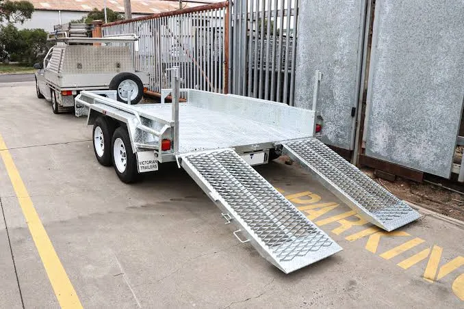 Galvanised tandem plant trailer with both ramps lowered, ready for loading